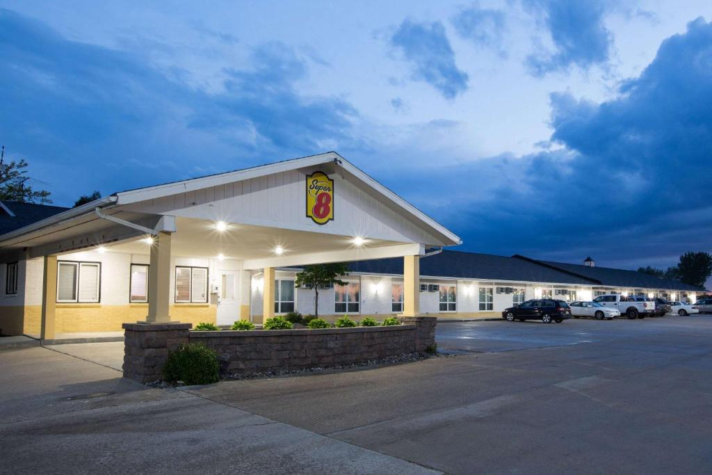 a mcdonalds restaurant with a car parked in a parking lot at Super 8 by Wyndham Williams in Williams