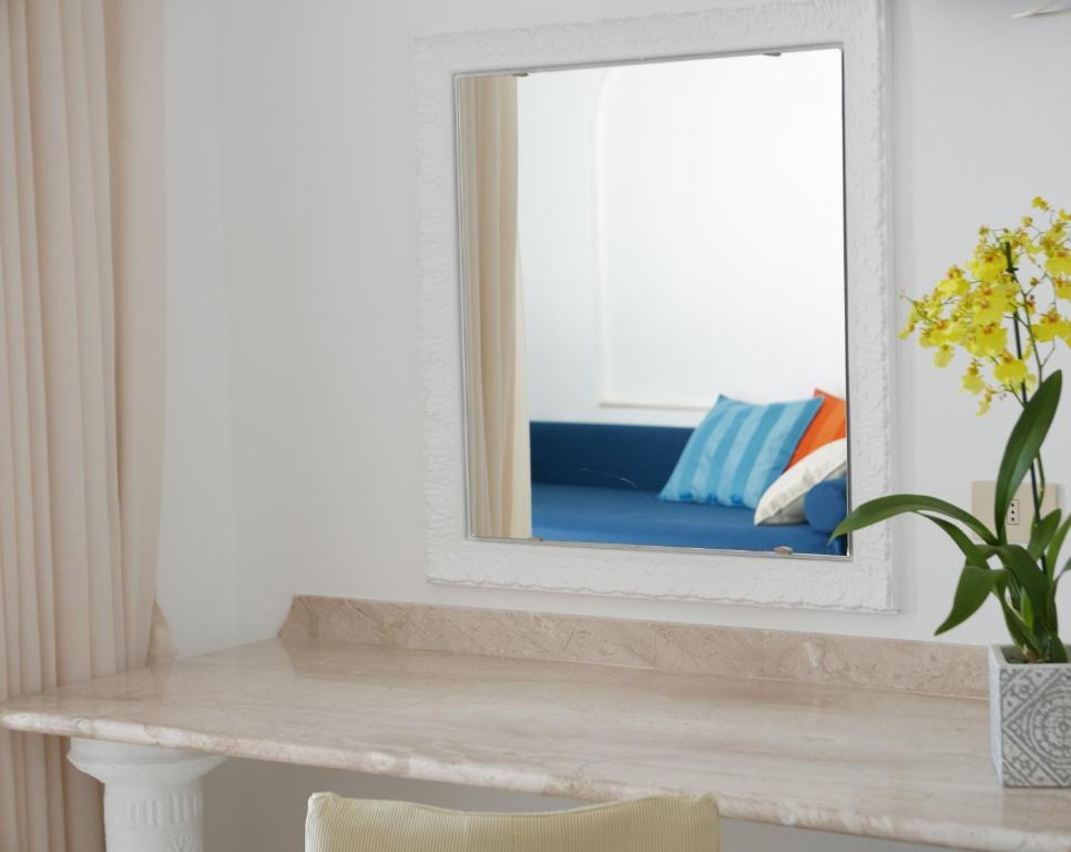 a mirror sitting on top of a counter in a room at Hotel Pupetto in Positano