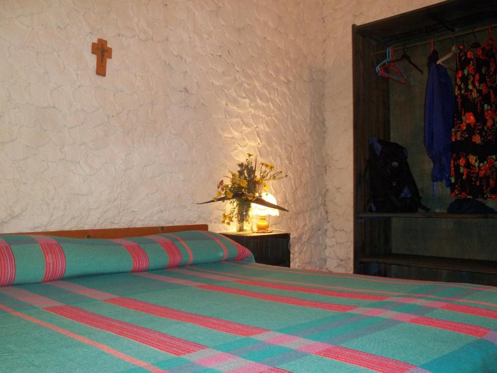 A bed or beds in a room at I Dammusi del Blu Green