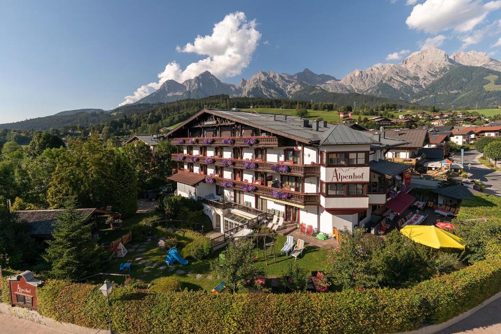 an aerial view of a hotel with mountains in the background at Der Alpenhof Maria Alm in Maria Alm am Steinernen Meer