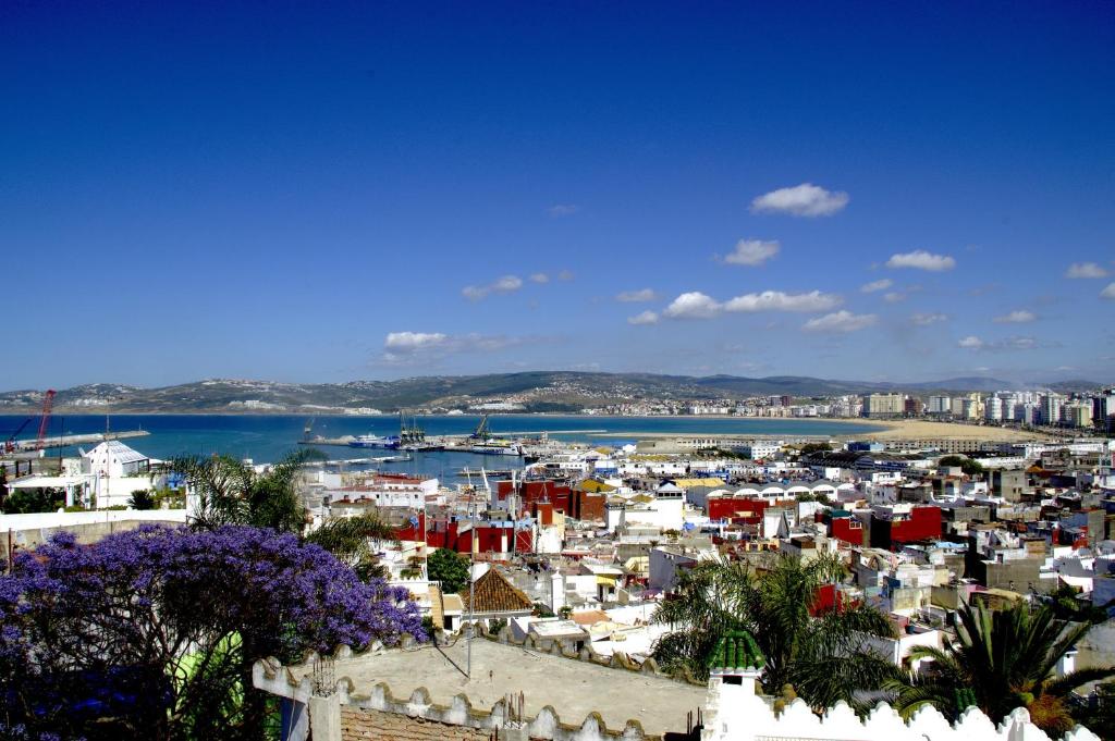 a view of a city with a harbor at Dar Chams Tanja in Tangier