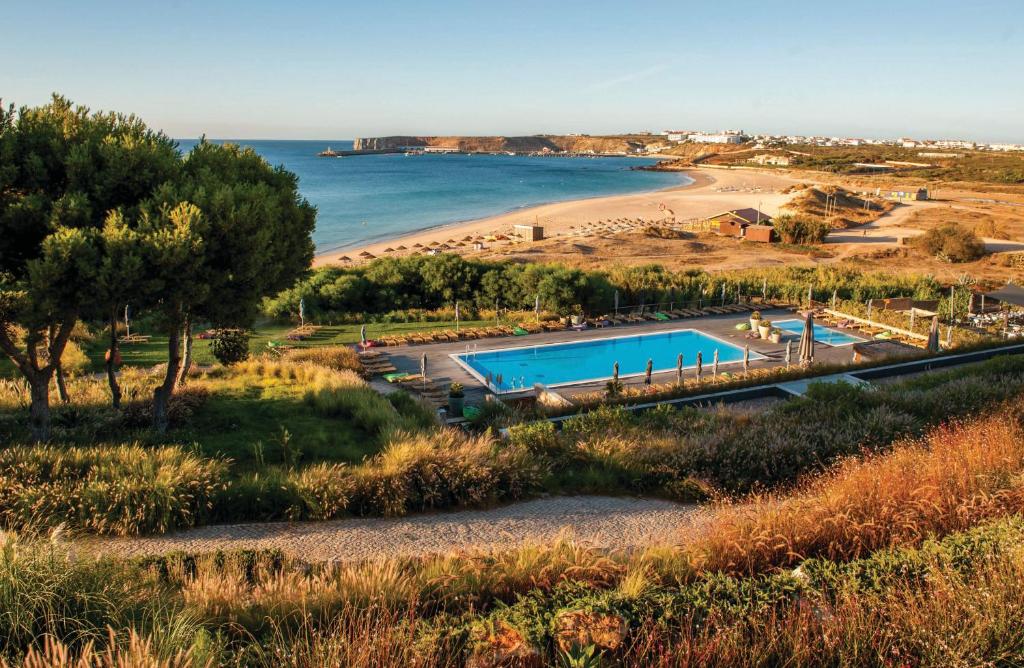 a resort with a beach and a swimming pool at Martinhal Sagres Beach Family Resort Hotel in Sagres