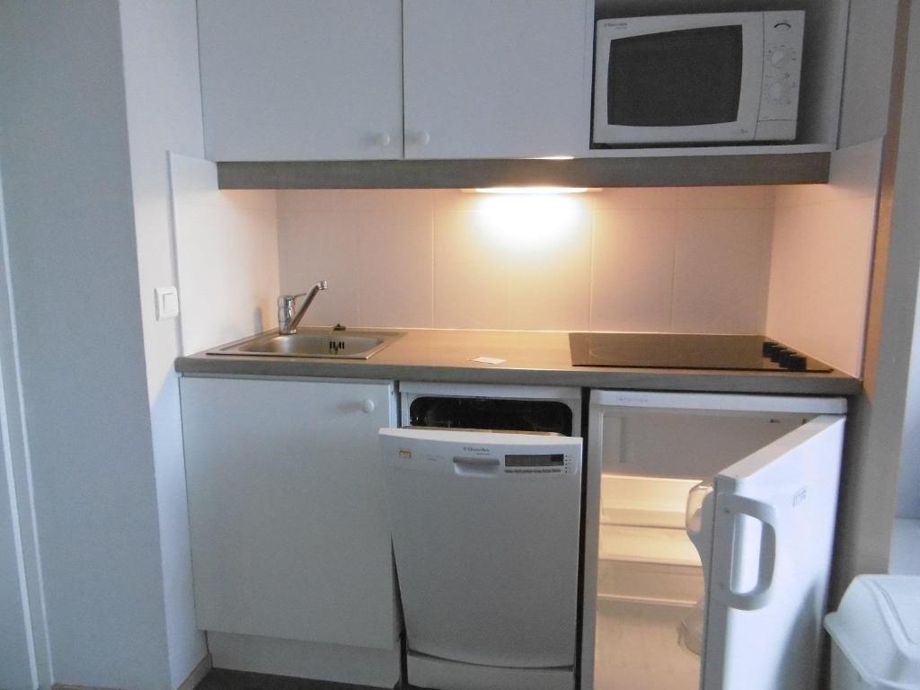 Kuchyň nebo kuchyňský kout v ubytování Appartements Duplex de Charme à Bénodet Vue Mer
