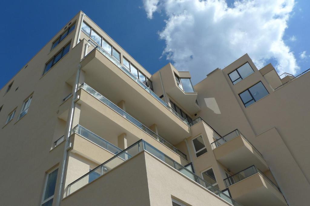 a building with balconies on the side of it at Hotel Adria in Dubrovnik