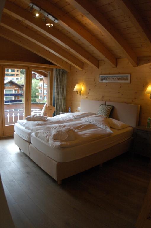 Postel nebo postele na pokoji v ubytování Chalet Guggenbiel