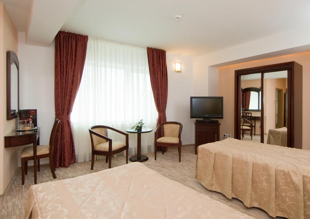 Postel nebo postele na pokoji v ubytování Hotel Ambient