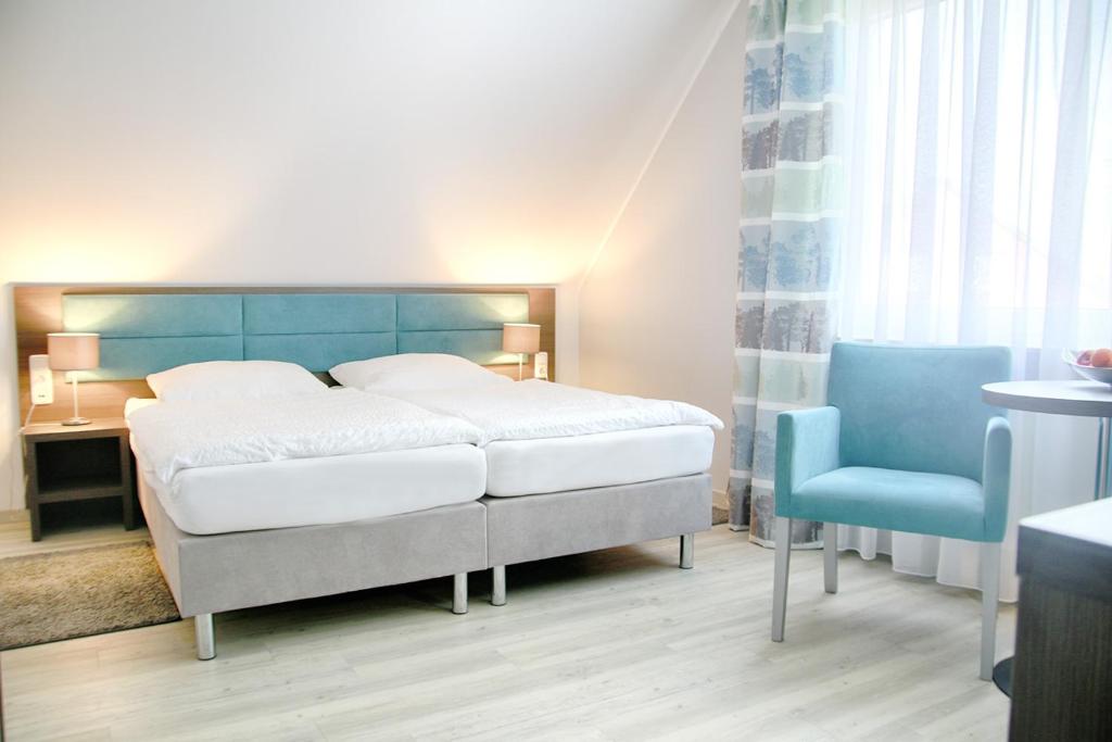 Postel nebo postele na pokoji v ubytování Hotel zur Eiche
