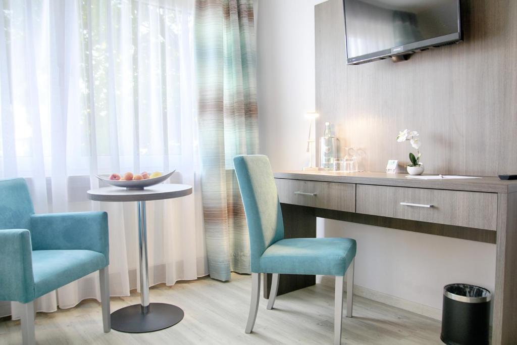 TV a/nebo společenská místnost v ubytování Hotel zur Eiche