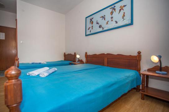 Postel nebo postele na pokoji v ubytování Vila Anita