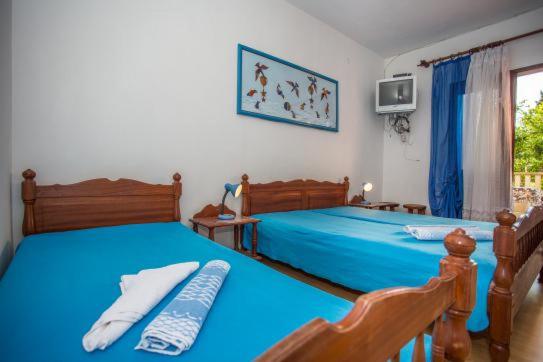 Postel nebo postele na pokoji v ubytování Vila Anita