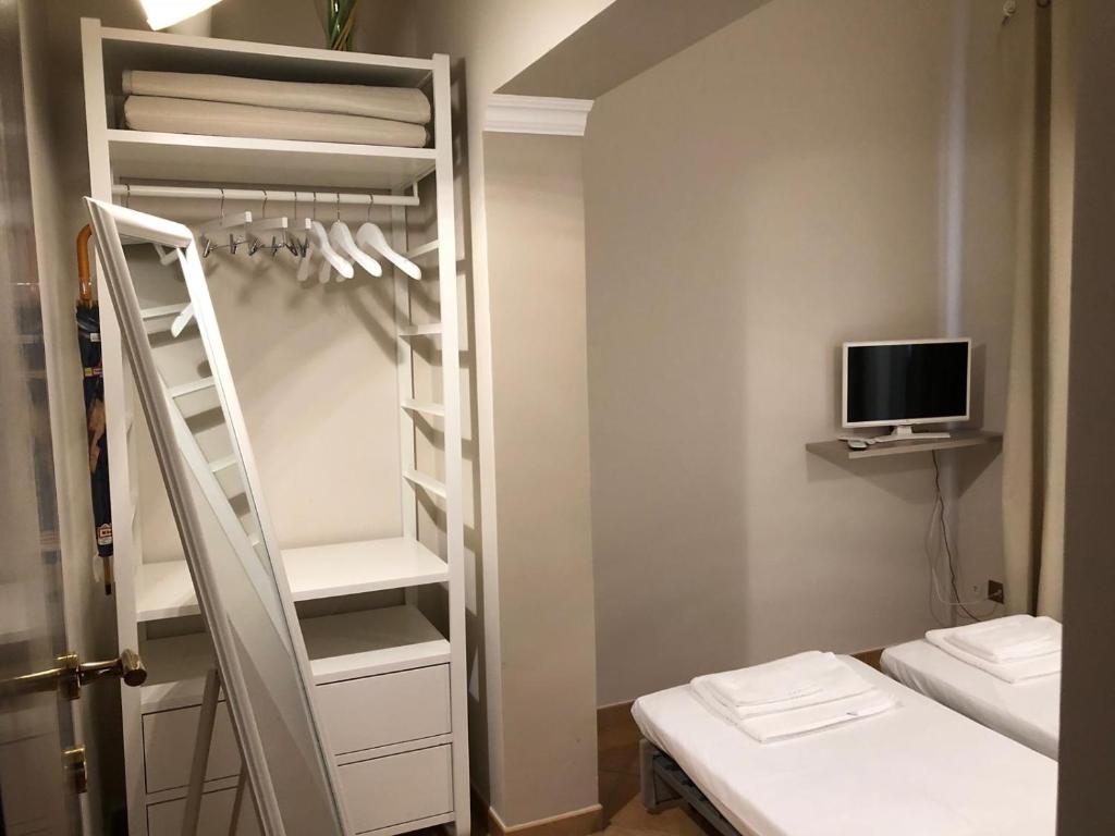 Posteľ alebo postele v izbe v ubytovaní A DUE PASSI temporary apartment