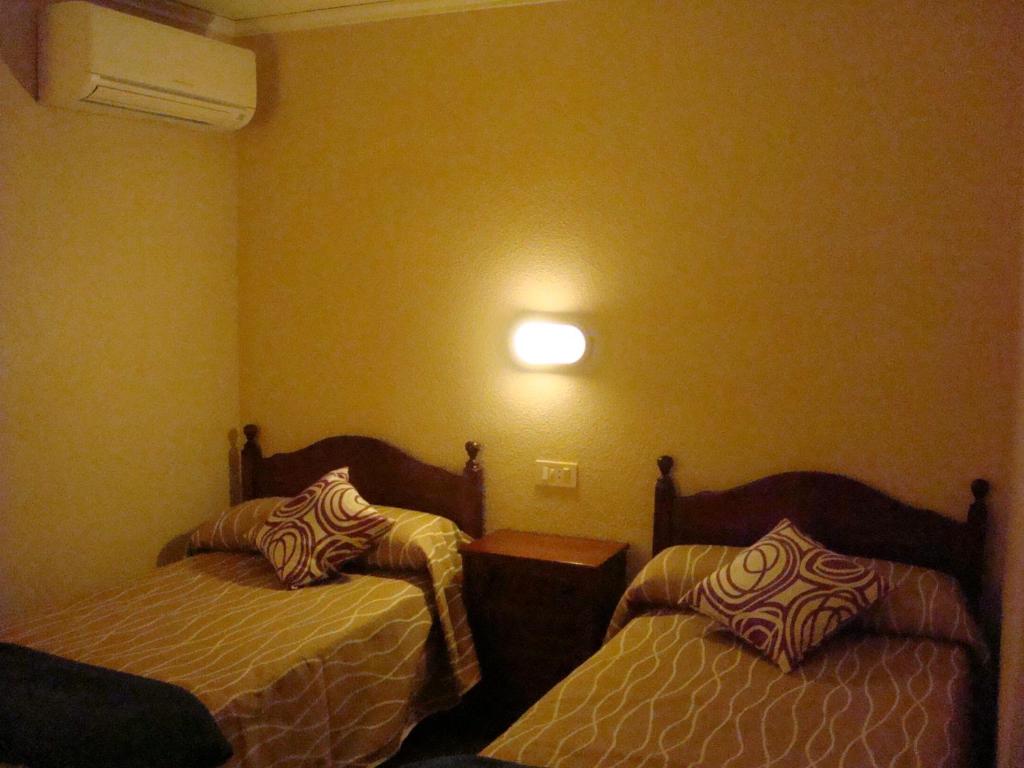 Postel nebo postele na pokoji v ubytování Hotel Fin De Semana