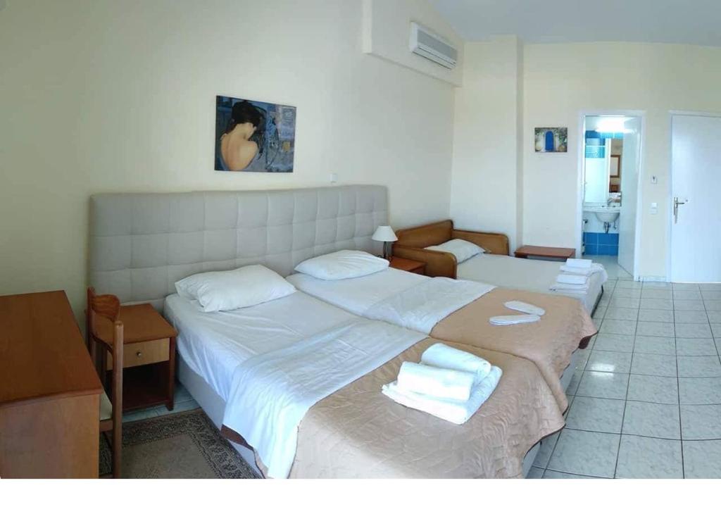 Voodi või voodid majutusasutuse Hotel Oasis toas