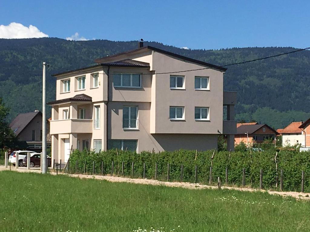 a large house with a fence in front of it at Urban villa in Sarajevo