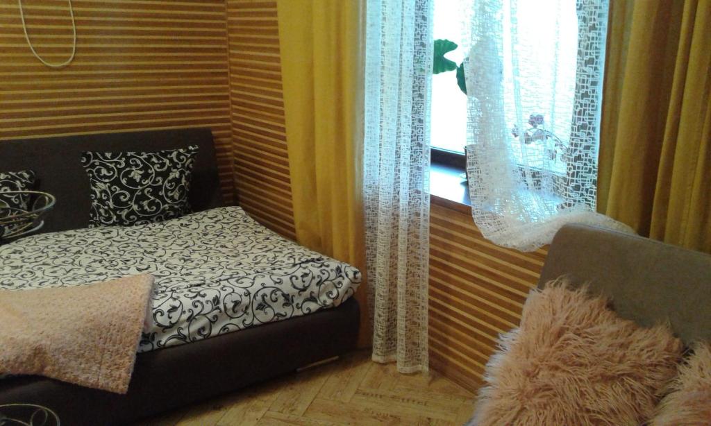 Postel nebo postele na pokoji v ubytování Апартаменты-студио