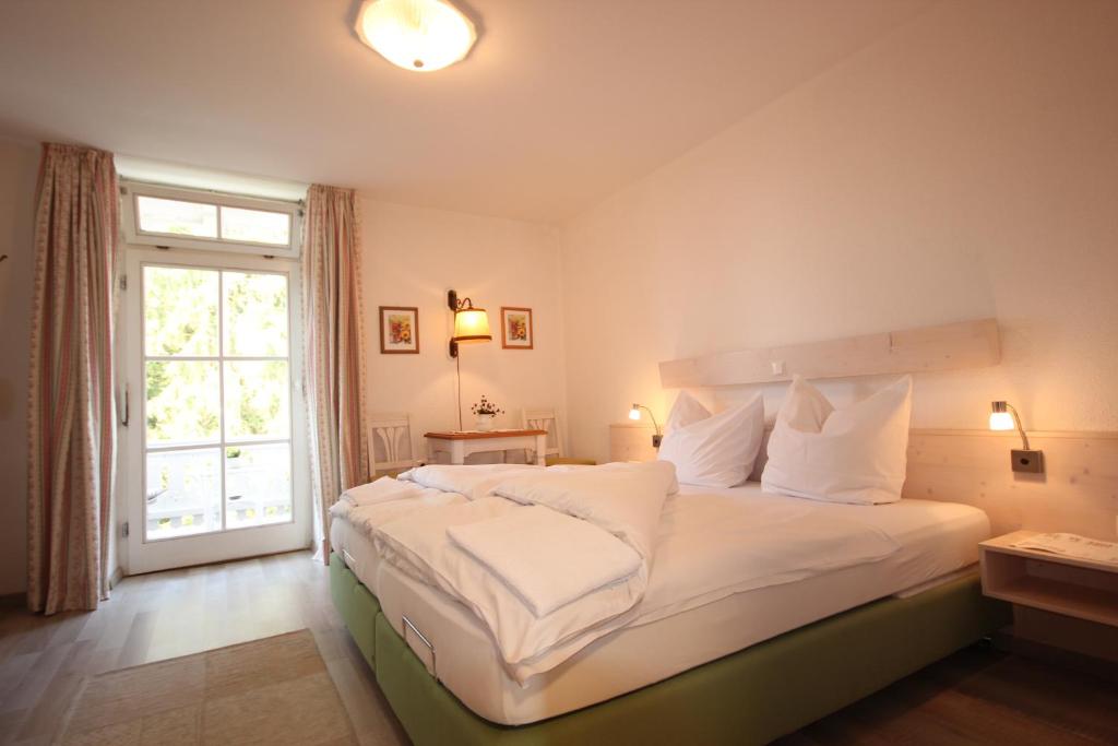 Postel nebo postele na pokoji v ubytování Hotel Villa Sisi