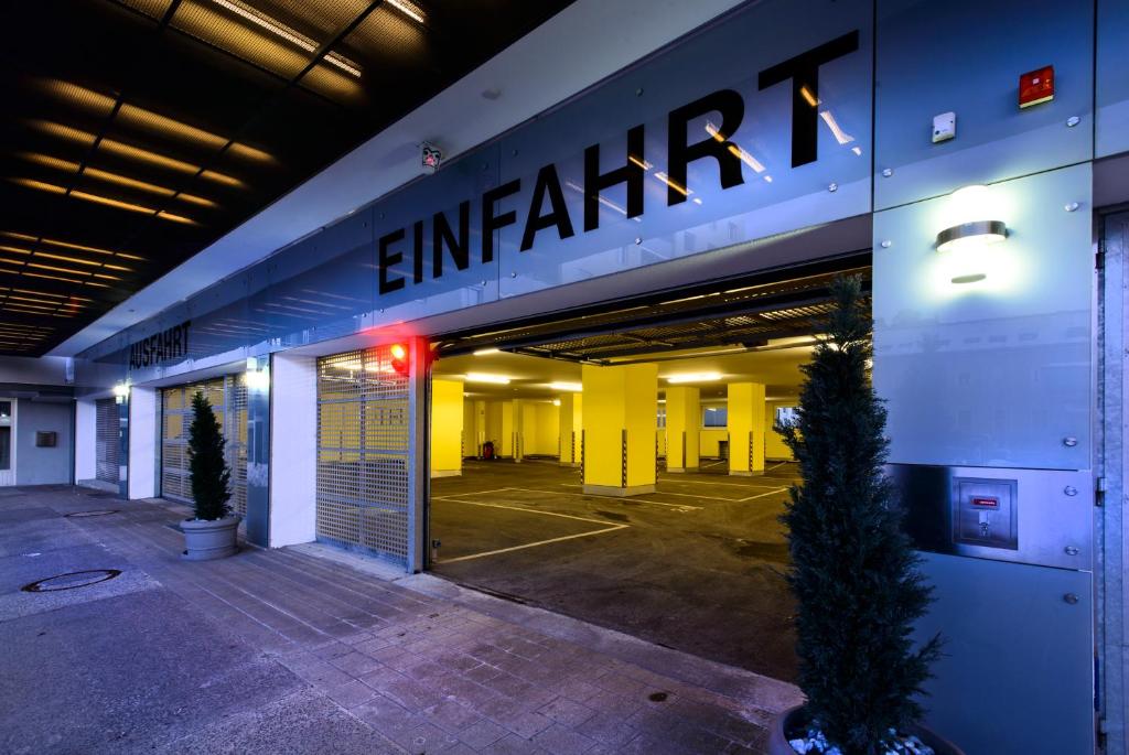 an entrance to a building with a sign on it at Hotel City in Villach