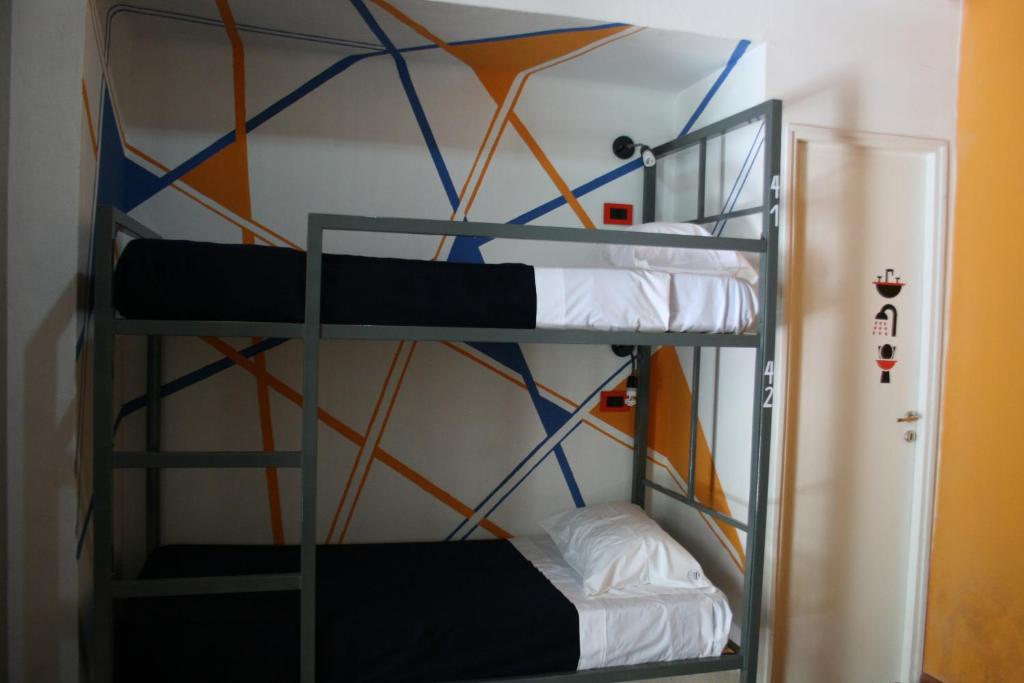 Postel nebo postele na pokoji v ubytování Antonieta Hostel