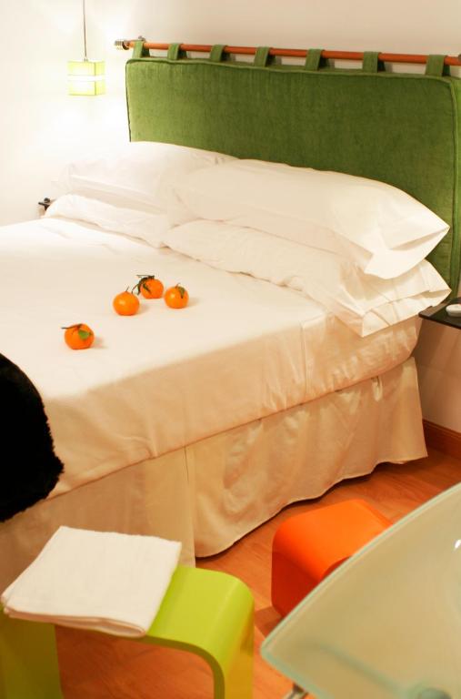Postel nebo postele na pokoji v ubytování Hostal Santo Domingo
