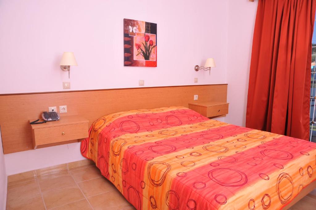 Postel nebo postele na pokoji v ubytování Argiro Village