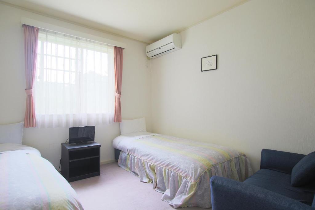 Postel nebo postele na pokoji v ubytování Mt Fuji B&B PENSION LE LAGON
