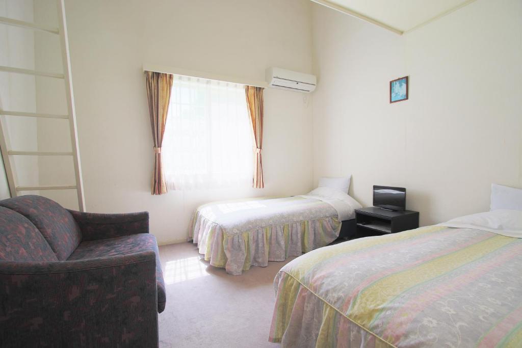 Postel nebo postele na pokoji v ubytování Mt Fuji B&B PENSION LE LAGON