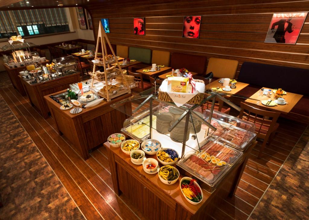 an overhead view of a buffet in a restaurant at Hotel City in Villach