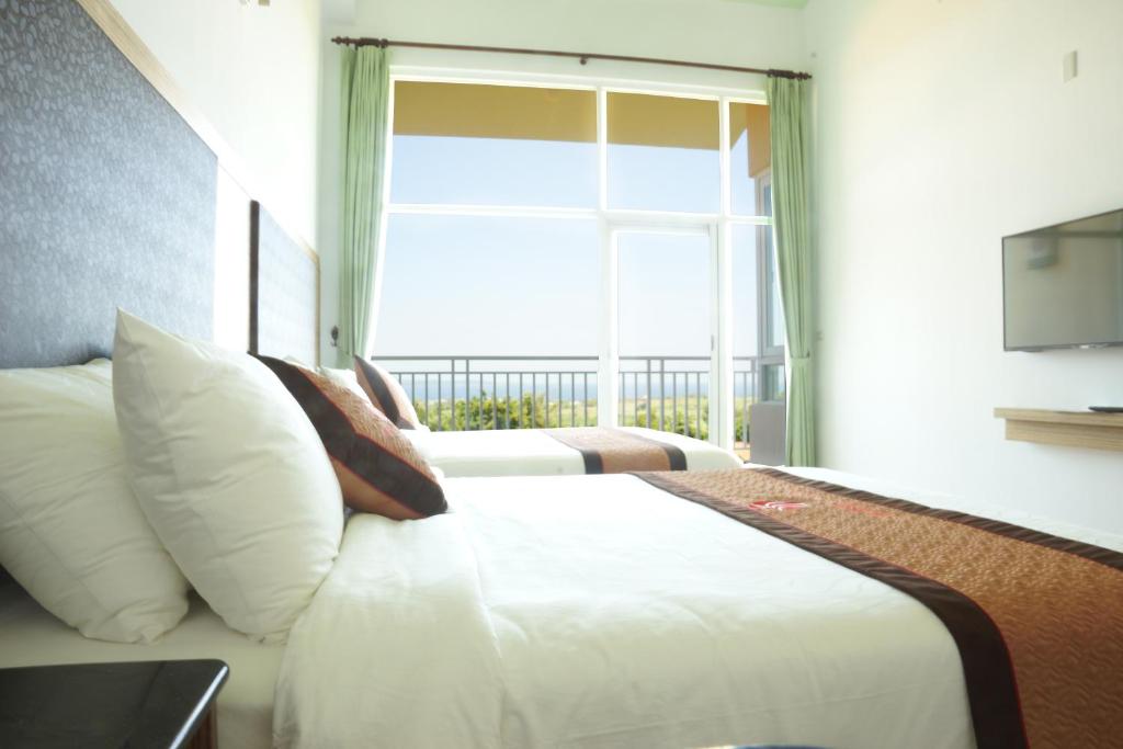 Postelja oz. postelje v sobi nastanitve Coral B&B