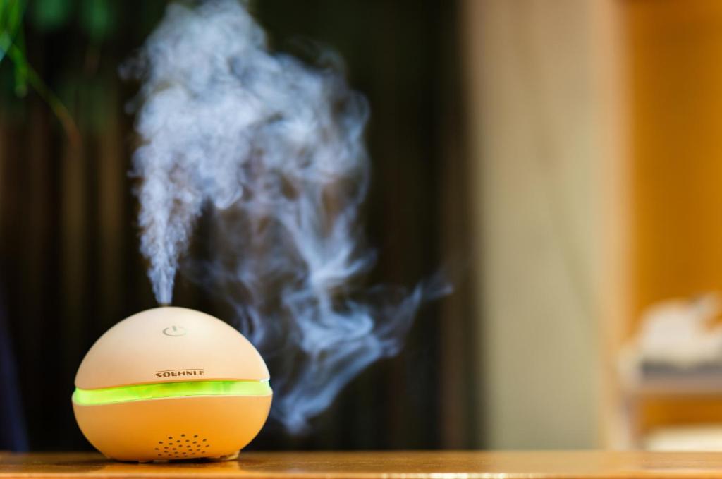 a tennis ball with smoke coming out of it at Hotel City in Villach