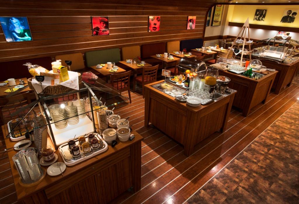 an overhead view of a restaurant with tables with food at Hotel City in Villach