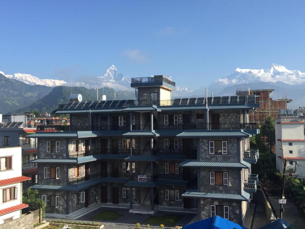 a building with solar panels on top of it at Hotel K2 Pokhara in Pokhara
