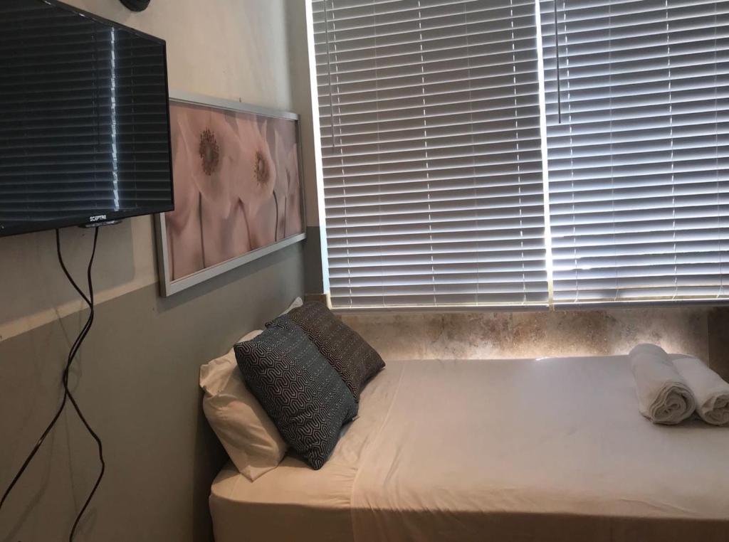Postel nebo postele na pokoji v ubytování Coco Mar Oceanview Studios