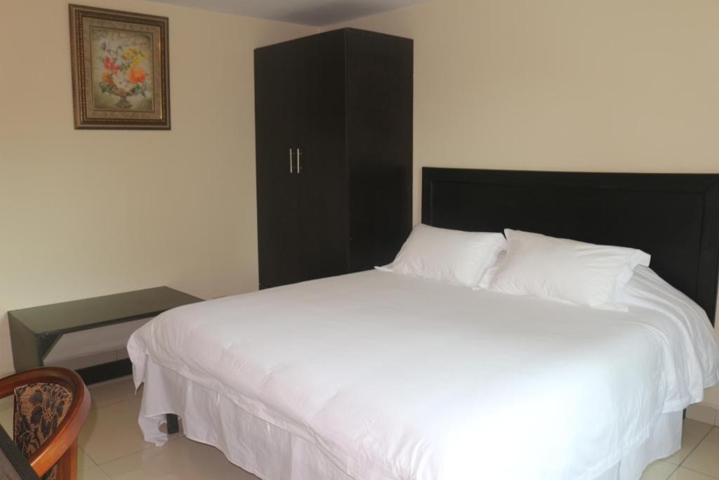 Voodi või voodid majutusasutuse Hotel F Sur Inn toas