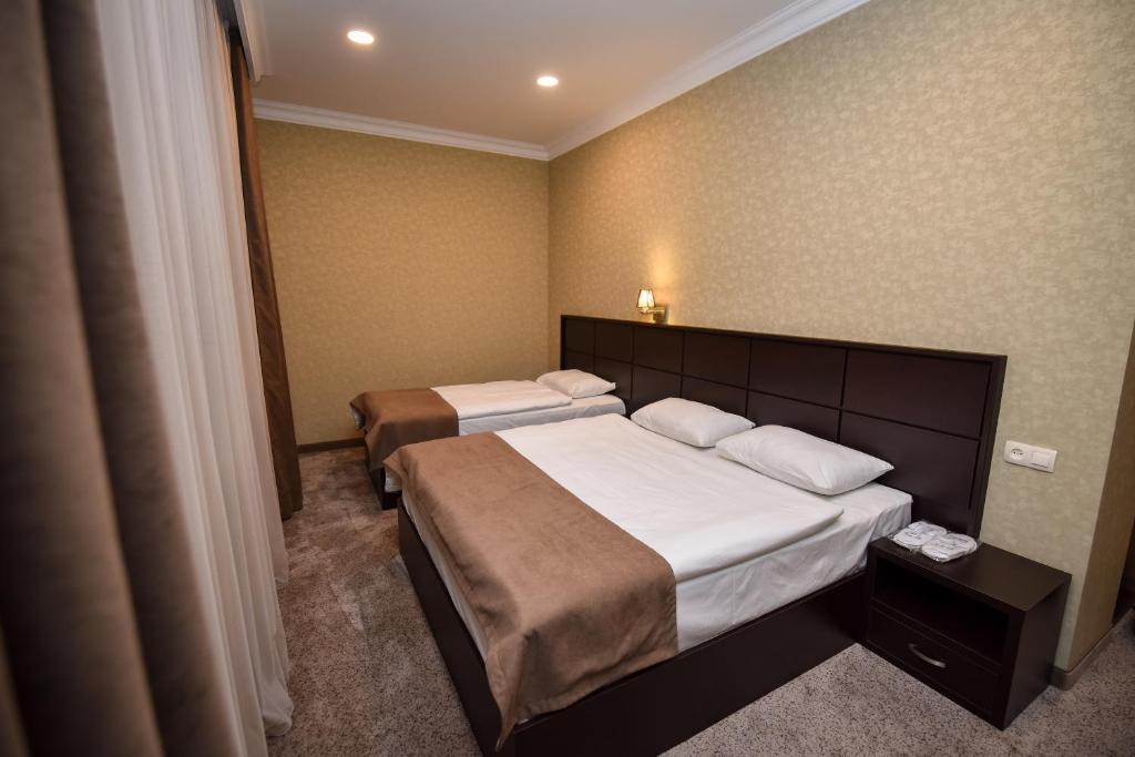 Postel nebo postele na pokoji v ubytování Laguna Hotel