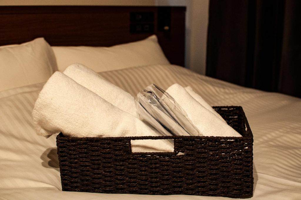 Postel nebo postele na pokoji v ubytování e-stay ebisu