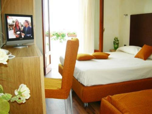 Letto o letti in una camera di Villa Nettuno