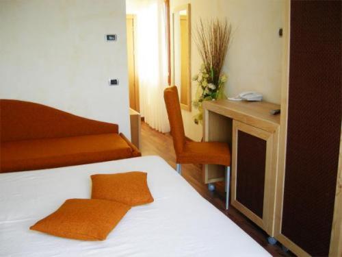 Letto o letti in una camera di Villa Nettuno