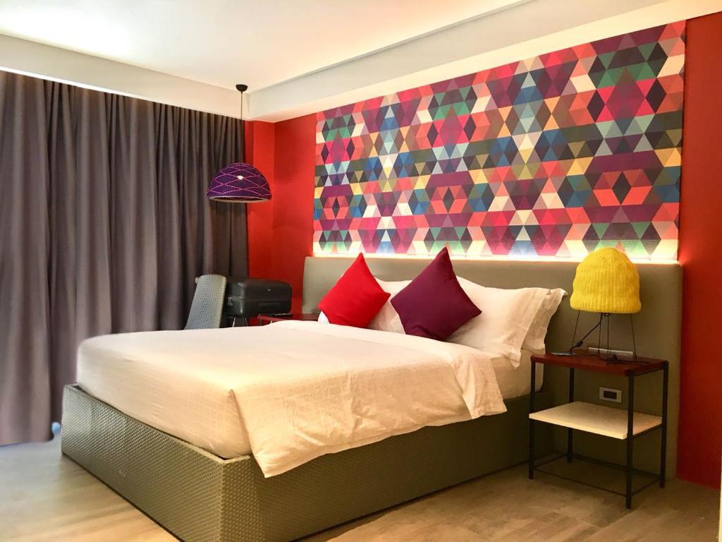 Llit o llits en una habitació de Lagùn Hotel