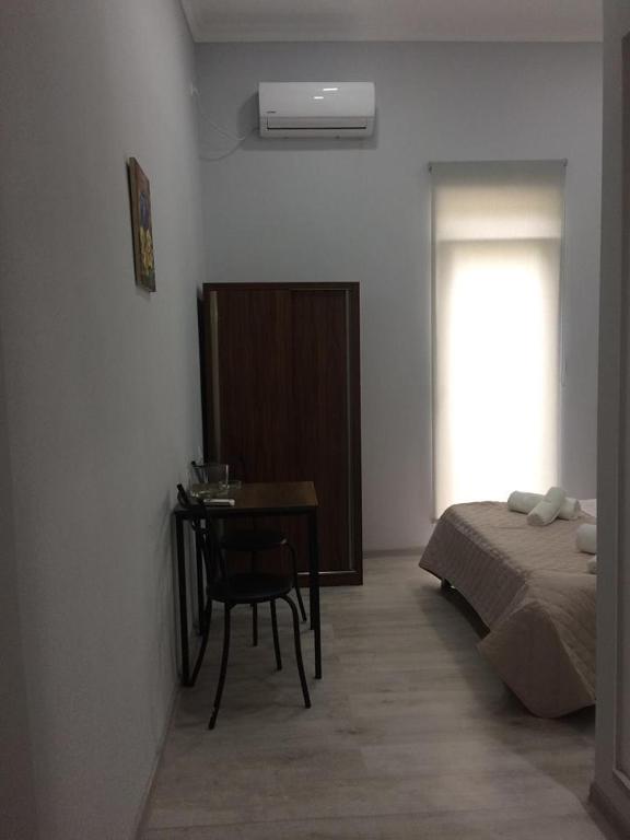 Postel nebo postele na pokoji v ubytování Kvara's House