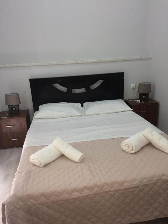 Postel nebo postele na pokoji v ubytování Kvara's House