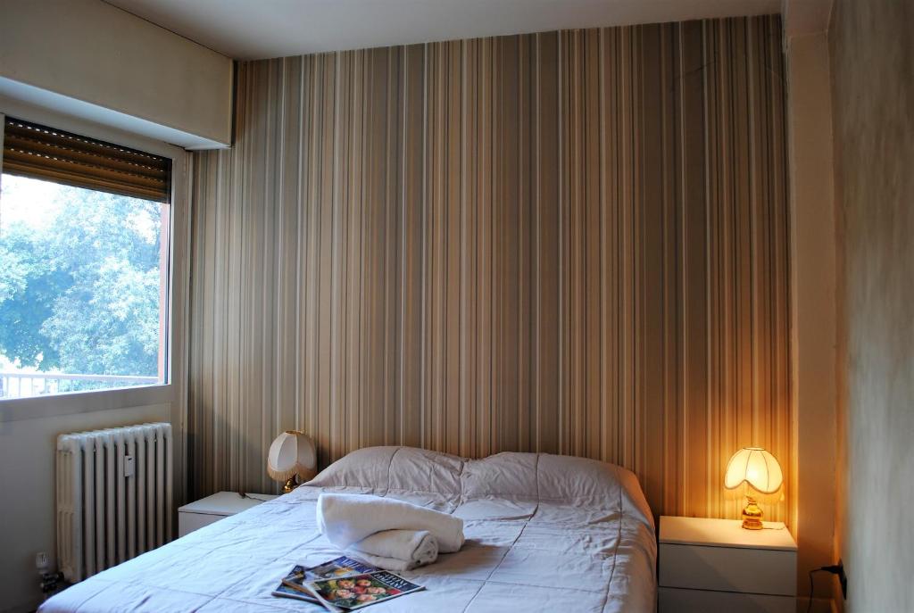 Posteľ alebo postele v izbe v ubytovaní Dreaming Piazza Bra Rooms