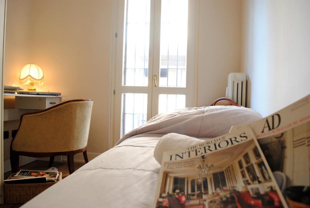 Posteľ alebo postele v izbe v ubytovaní Dreaming Piazza Bra Rooms