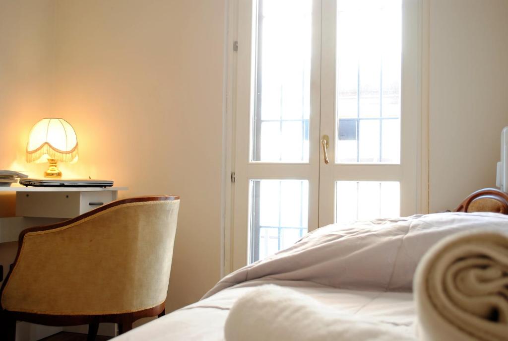 Posteľ alebo postele v izbe v ubytovaní Dreaming Piazza Bra Rooms