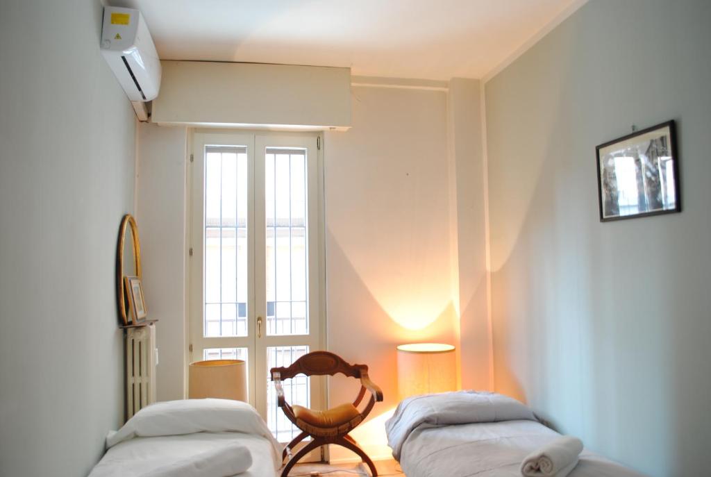 Posteľ alebo postele v izbe v ubytovaní Dreaming Piazza Bra Rooms