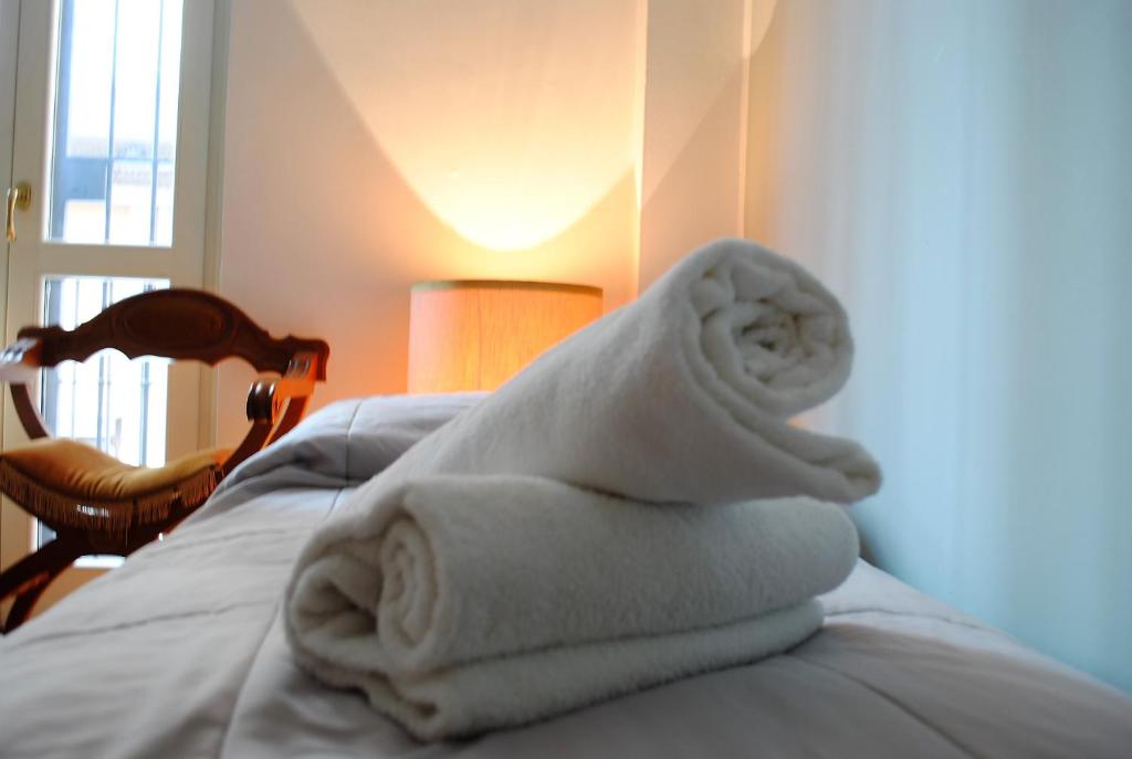 Posteľ alebo postele v izbe v ubytovaní Dreaming Piazza Bra Rooms
