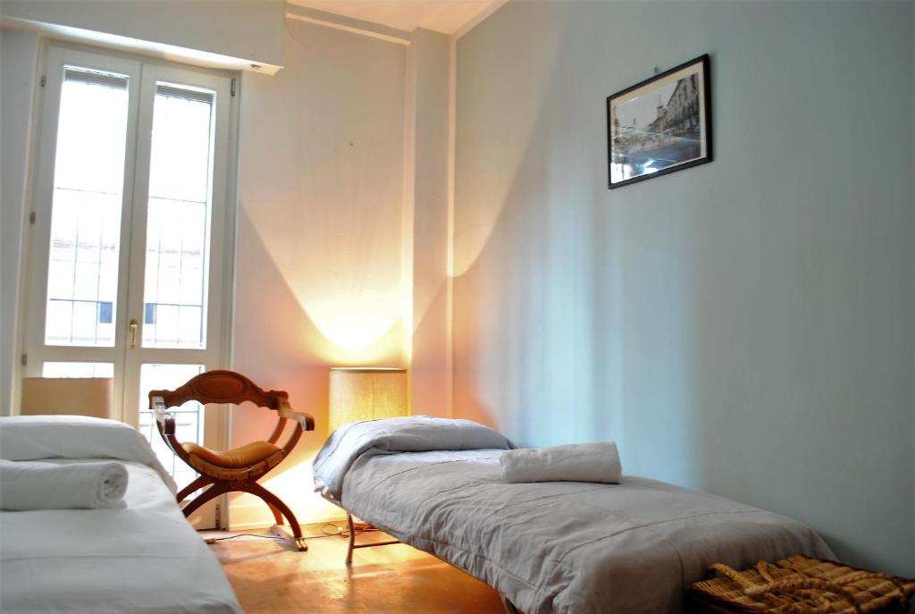 Posteľ alebo postele v izbe v ubytovaní Dreaming Piazza Bra Rooms