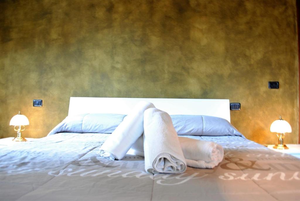 Posteľ alebo postele v izbe v ubytovaní Dreaming Piazza Bra Rooms