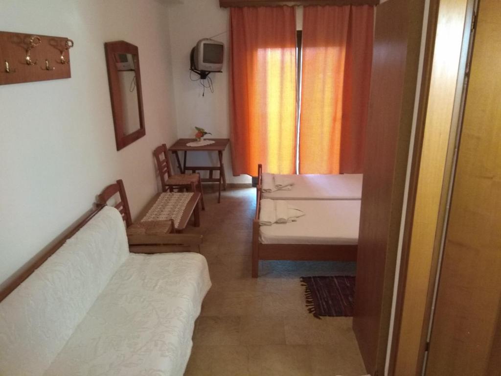 Postel nebo postele na pokoji v ubytování Panorama Palaiοpolis