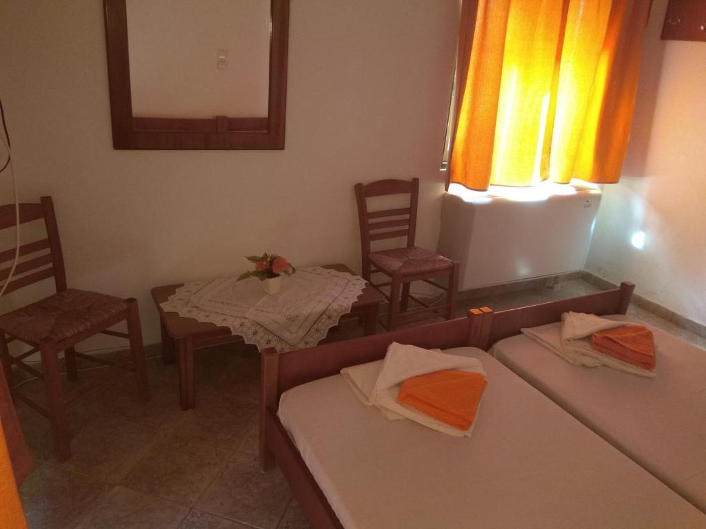 Postel nebo postele na pokoji v ubytování Panorama Palaiοpolis