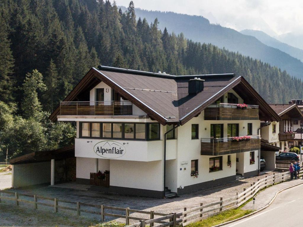 a large white building with a brown roof at Alpenflair in Gerlos